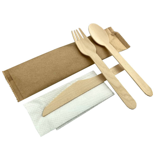 A wooden cutlery set featuring a fork, knife, and spoon, packaged with a napkin in a brown sleeve.