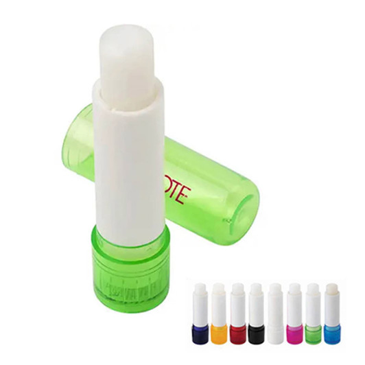 A lip balm stick with a white applicator and a green container, displayed next to a variety of coloured options.