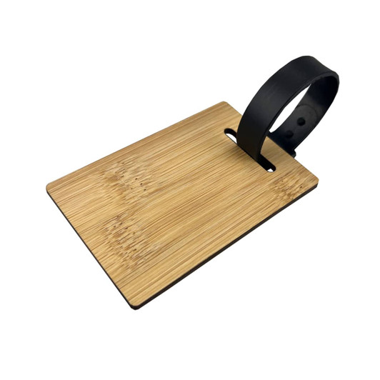 A bamboo luggage tag with a black strap, featuring a smooth, natural wood texture.