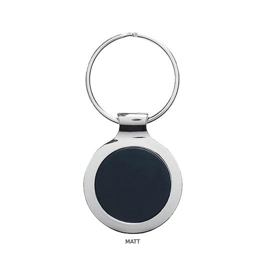 A matte black key ring with a polished silver metal rim and a circular design. It features a branding logo.