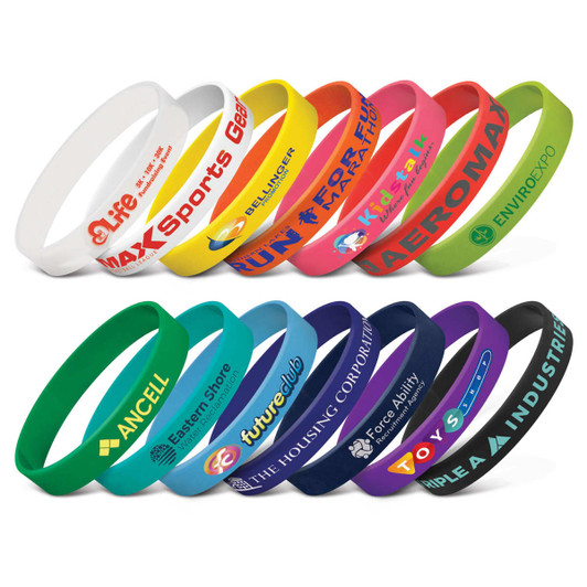 A collection of silicone wristbands in various colours, each featuring distinct logos or branding.