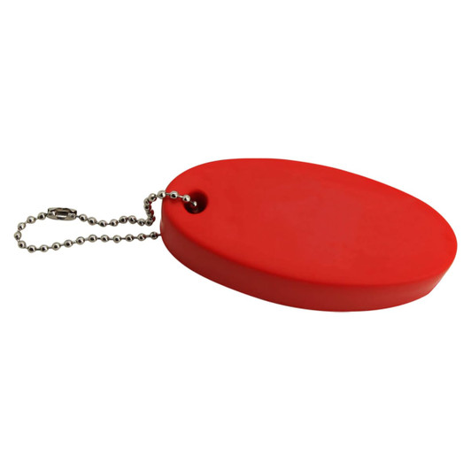 A red stress floating key ring with a rounded oval shape, attached to a small metal chain.