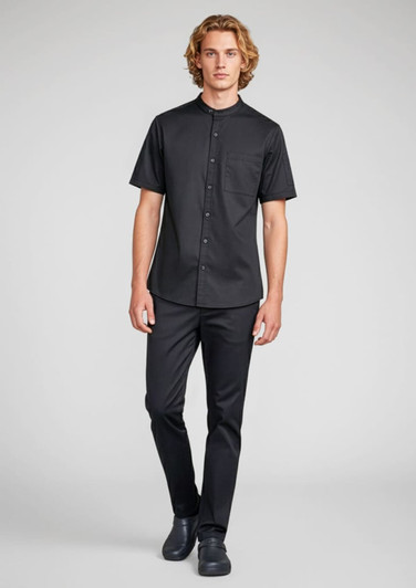 A short-sleeve black chef shirt worn by a model, featuring a button-up design and a chest pocket.