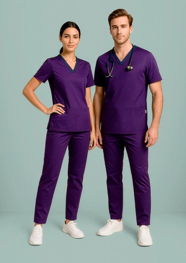 Purple scrub pants featured alongside a matching top, modelled by a woman and a man, both standing against a light background.