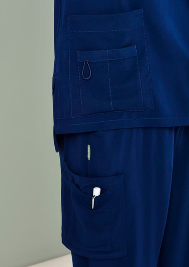 Navy blue women's scrub pants featuring multiple pockets and a loop for attachments.