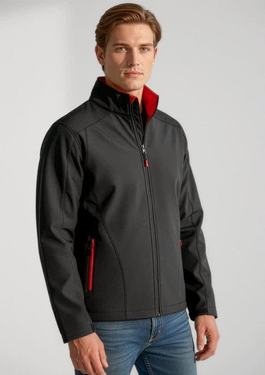 A soft shell jacket in black with red accents, featuring a zip front and zippered pockets, worn by a model.