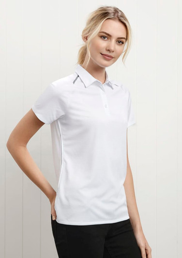 A women's short sleeve polo shirt in white with a collar, featuring a logo on the chest.