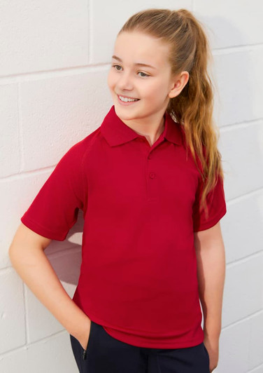 A red short sleeve polo shirt for kids, featuring a collar and a branding logo.