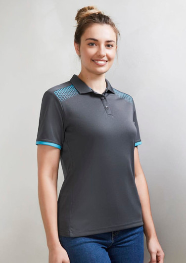 A women's short sleeve polo in grey with blue accents and a logo. Suitable for casual wear.