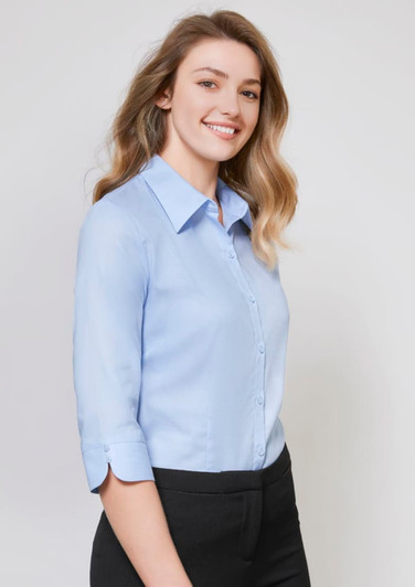 A light blue women's button-up shirt with 3/4 sleeves, featuring a collar and a fitted design.