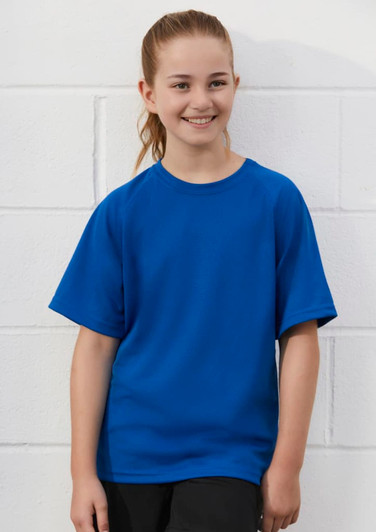 A blue short sleeve tee with a relaxed fit, featuring a logo, worn by a smiling child.