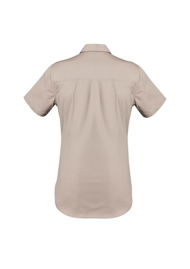 A short sleeve women's work shirt in a light beige colour, featuring a back yoke and a brand logo.