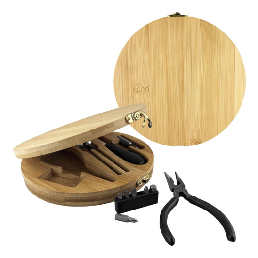 A bamboo toolkit featuring various tools, including pliers, inside a round bamboo case with a clasp.