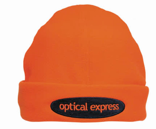 An orange beanie with a black patch featuring a logo. The beanie has a soft, textured appearance.