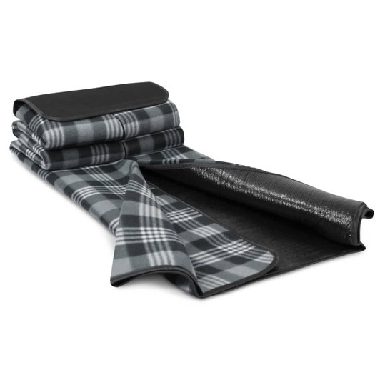 A folded picnic blanket in grey and black plaid, featuring a smooth black underside and a rolled-up design.
