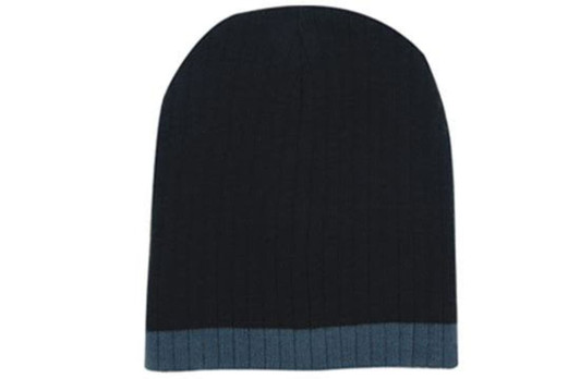 A two-tone cable knit beanie in dark navy blue with a lighter blue trim. It features a branding logo.