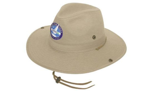 A khaki cotton twill hat with a wide brim, featuring an attached adjustable chin strap and a logo.