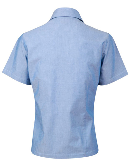 A light blue ladies' chambray short sleeve shirt with a button-up design, featuring a collar and no visible branding.