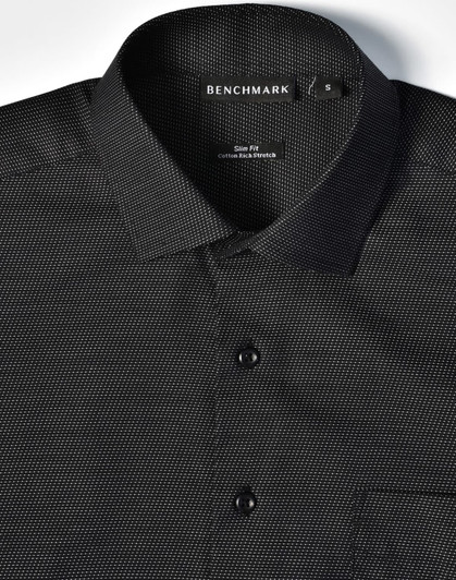 A black pin dot short-sleeve button-up shirt featuring a collar, buttons, and a pocket, with a logo on the label.