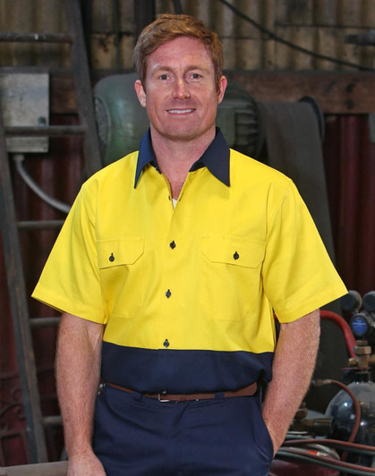 A short-sleeved Hi-Vis work shirt in yellow and navy with a logo and button details.