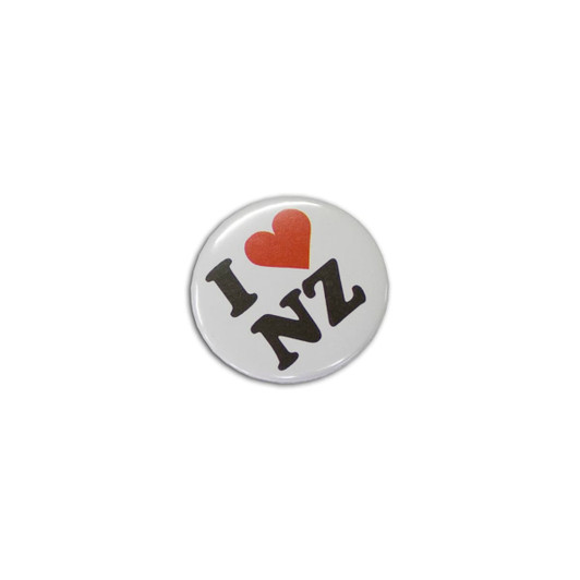 A round button badge, 37mm in size, featuring the text "I ❤️ NZ" in bold black letters with a red heart icon.