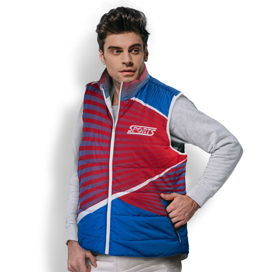 A puffer vest in red and blue, featuring a logo, worn by a model against a white background.