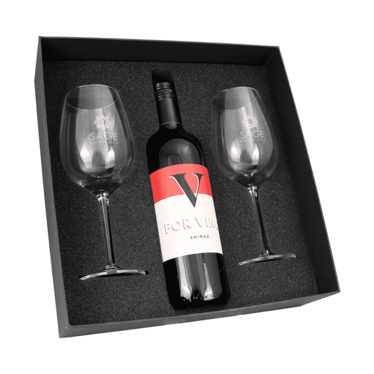 A wine box containing a bottle of Shiraz and two clear wine glasses, all set against a black foam base.