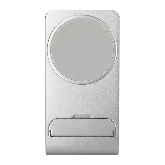 A silver wireless charging stand with a circular charging pad and a sleek, minimalist design. Includes a logo.