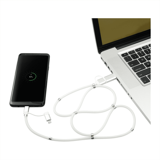 A white 5-in-1 charging cable with a magnetic wrap connected to a laptop and a mobile phone displaying a battery percentage.