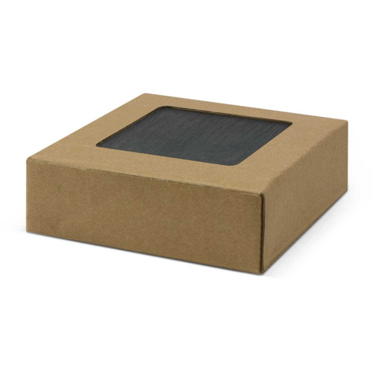 A set of four slate coasters packaged in a simple cardboard box with a window.