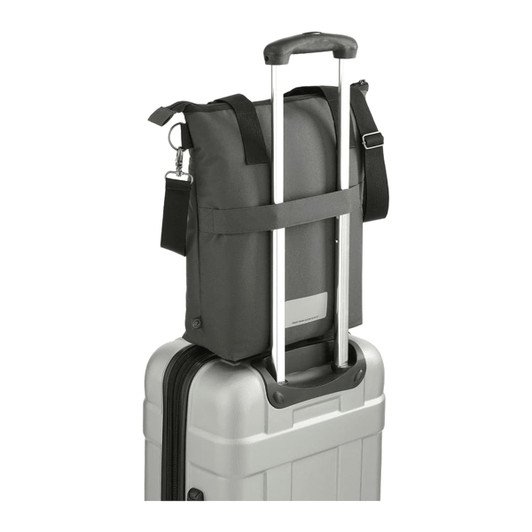 A black laptop tote made from recycled material, sitting atop a silver suitcase with extending handles.