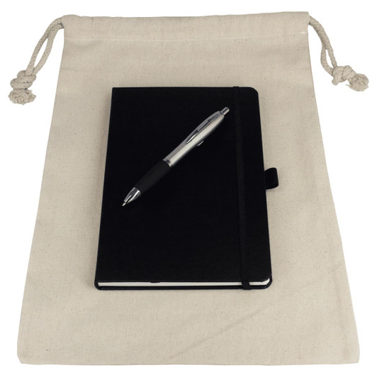 A natural drawstring bag containing a black journal book and a silver pen. The bag is unbranded.