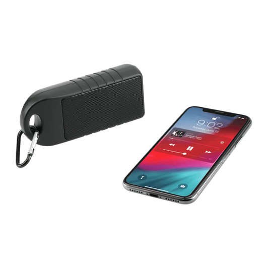 A black Bluetooth speaker with a textured surface and a carabiner, alongside a smartphone displaying a music app.