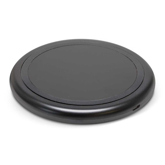 A round, black wireless charger with a smooth surface and a port on the side.