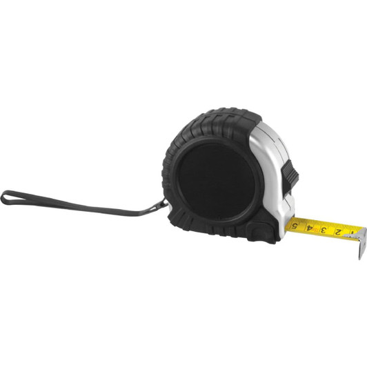 A black and silver tape measure with a rubber grip and a yellow measuring tape extended. It features a logo on one side.