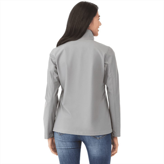 A women's grey softshell jacket with a high collar and fitted design, featuring a logo.