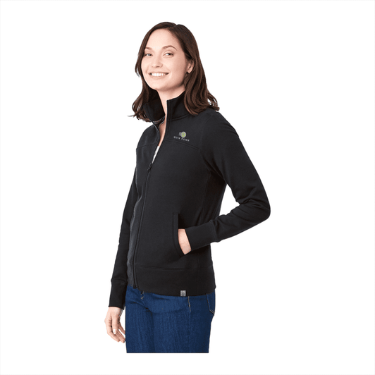 A woman wearing a black Argus Eco Fleece Full Zip jacket, featuring a logo on the chest.