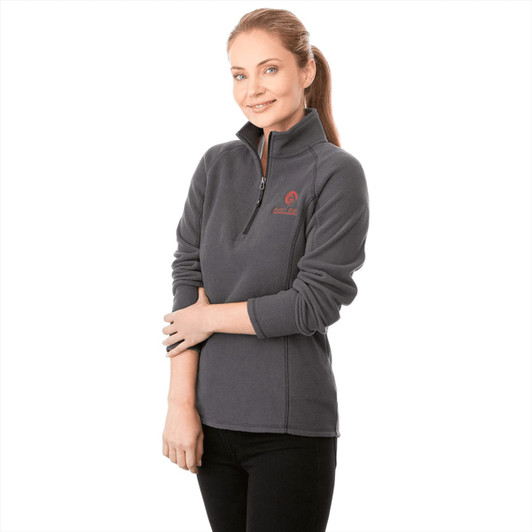 A women's polar fleece half zip jacket in grey, featuring a logo on the chest.