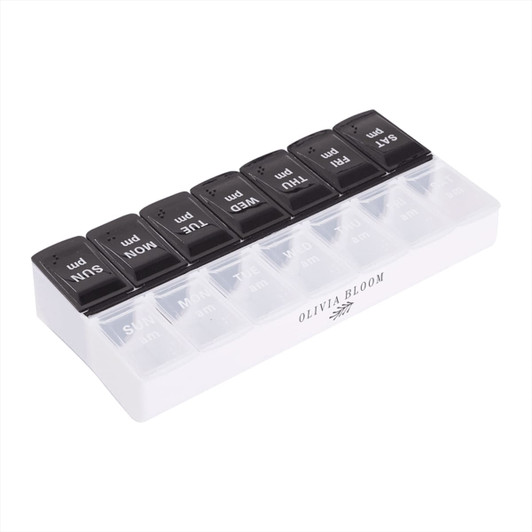 A transparent AM/PM pill case with black lids labelled for each day of the week. It features a logo on the side.