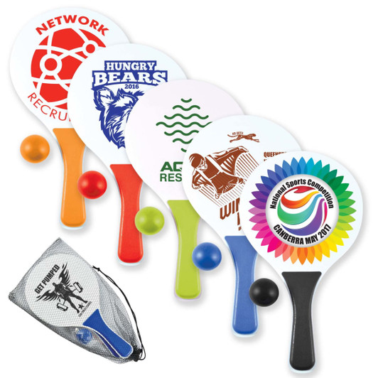 A set of paddles in various colors with balls, featuring different logos and designs, packaged in a mesh carrying bag.