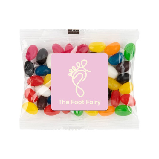 A cello bag filled with assorted color mini jelly beans, including red, yellow, green, and black candies.