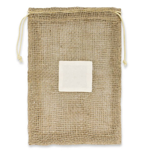 A jute net produce bag with a drawstring closure and a white label patch in the center.