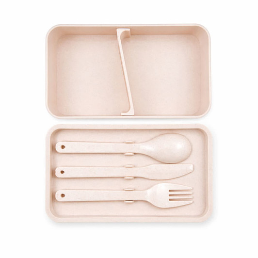 A light pink eco lunch box featuring a divider and matching cutlery set including a spoon, fork, and knife.
