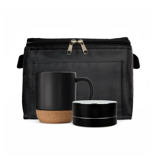 A black espresso coffee cup with a cork base and a matching speaker, placed in a black zippered pouch.