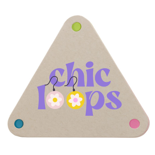 A triangular sticky note pad in beige with colorful corners, featuring the text "chic loops" in purple and floral graphics.