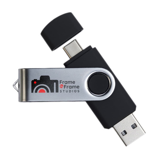 A black and silver swivel USB flash drive with dual connectors and a logo on the side.