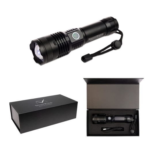 A black rechargeable torch with a strap, located in a sleek box along with a charging cable.
