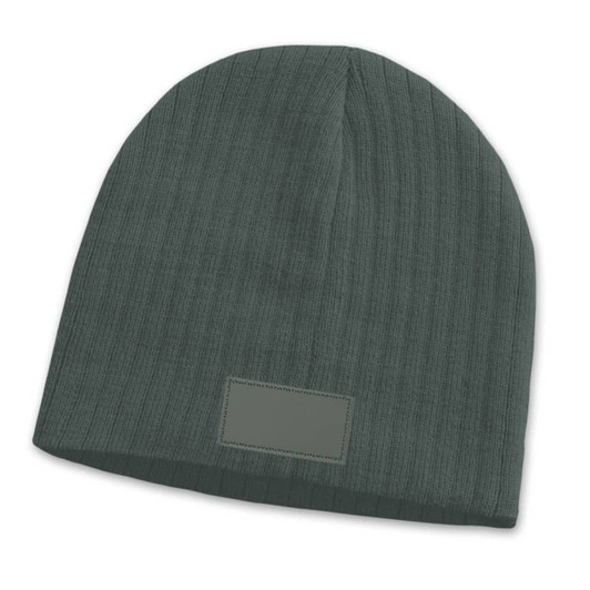 A green cable knit beanie with a patch, featuring a textured design.