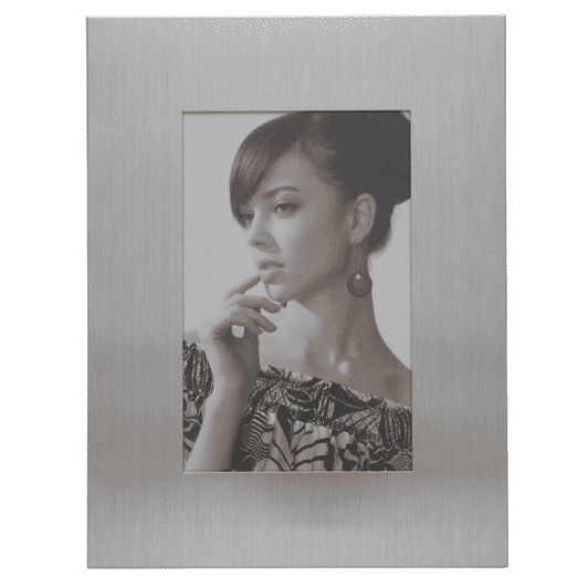 A silver photo frame featuring a portrait of a woman with dark hair and earrings.