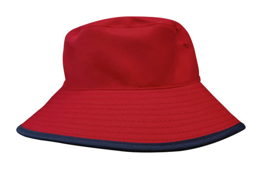 A reversible bucket hat in red with a navy blue brim, featuring branding. Made from breathable poly twill fabric.